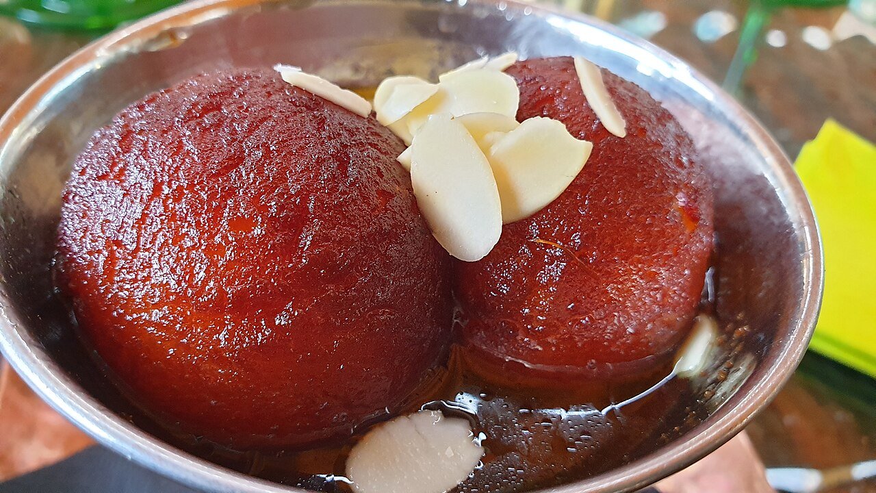 Gulab Jamun — milk dumplings in rose and cardamom syrup, Indian halal dessert